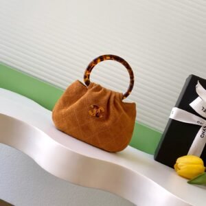 Iconic Suede Calfskin Pouch with Tortoiseshell-Effect Acrylic Handle